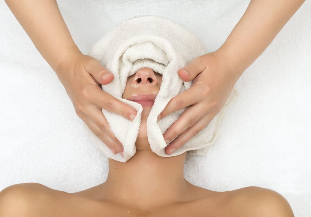 A beautician wrapped face with warm,wet towels.